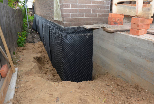 Happy homeowners after waterproofing job in Abell
